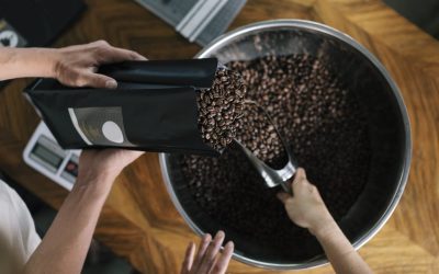 People working inRoastery filling package of specialty coffee.